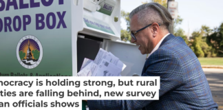 Lansing City Clerk Chris Swope collects absentee ballots from a drop box in 2024. Bill Pugliano/Getty Images